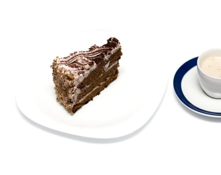 chocolate cake and mug with a cappuccino, on the isolated background
