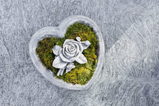 Marble heart with rose as grave decoration