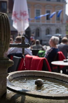Dripping fountain in front of a cafe in Potsdam