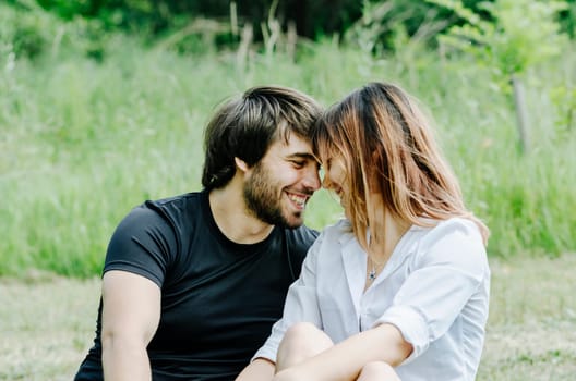 Happy couple hugging in nature