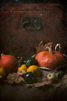 Still life with pumpkins and autumn leaves. Texture added.