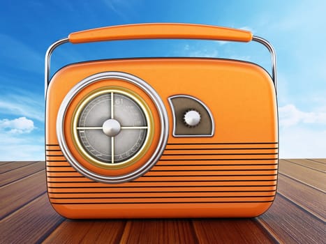 Vintage orange radio standing on wooden planks