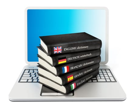 Dictionaries standing on laptop computer isolated on white background