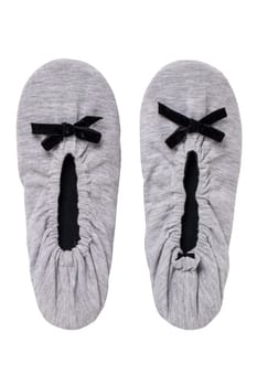 Slippers isolated. Close-up of a pair of female gray warm and soft cosy slippers with non-slip sole isolated on white background. Shoes of a woman. Macro.