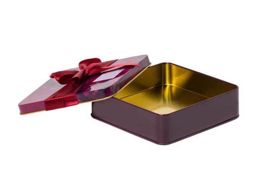 Closeup of a decorative opened red pink present or gift box with ribbon bow isolated on a white background. Birthday, Christmas, Valentine's Day. Macro.