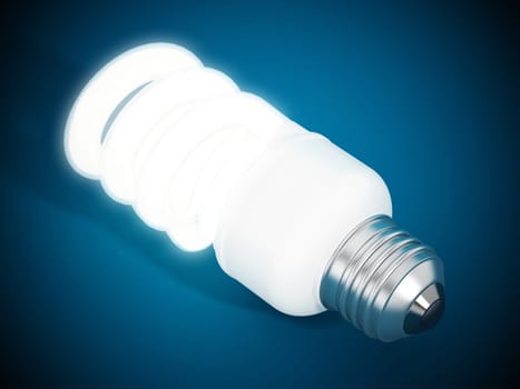 Fluorescent energy saving lightbulb on blue surface.