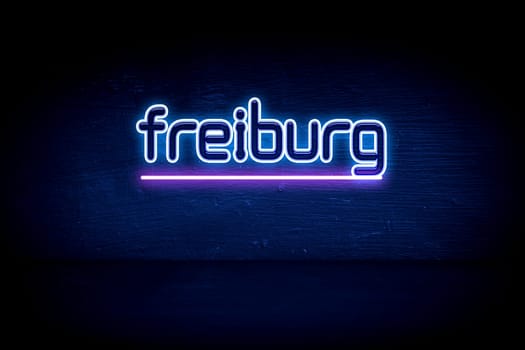 Freiburg - blue neon announcement signboard