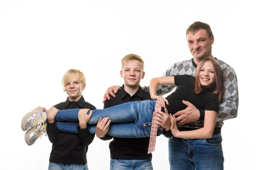Dad and two sons holding a teenage girl in their arms, casual wear in dark colors, white background