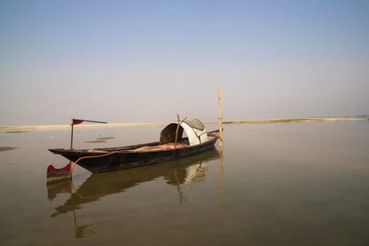 A Wooden Fishing Boat in Padma River by Bangladesh. Beautiful Landscape View