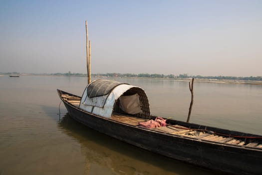A Wooden Fishing Boat in Padma River by Bangladesh. Beautiful Landscape View