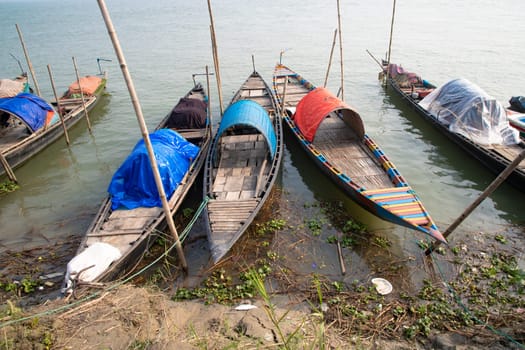 Beautiful view of Traditional Some wooden fishing boat on Padma river by Bangladesh. Natural Landscape view