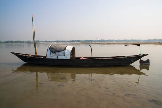 A Wooden Fishing Boat in Padma River by Bangladesh. Beautiful Landscape View