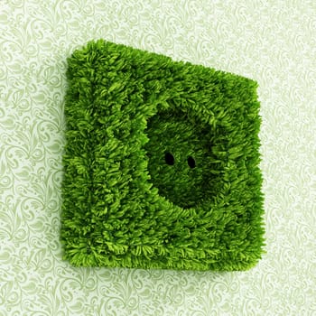 Power outlet covered with green grass