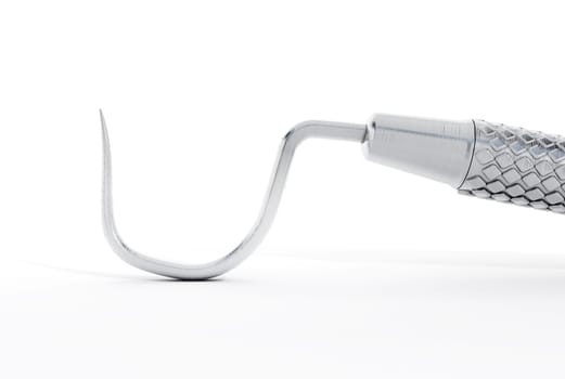 Dentist tool isolated on white background.