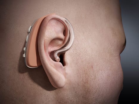 Ear aid or hearing aid on man's ear