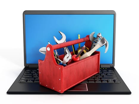 Red toolbox standing on laptop computer isolated on white background