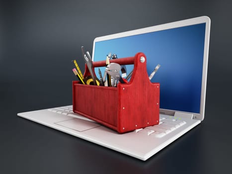 Red toolbox standing on laptop computer isolated on black background