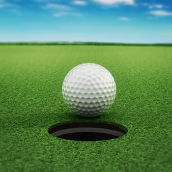 Golf ball standing near the hole on green grass