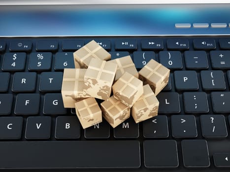 Cardboard boxes standing on laptop computer keyboard.