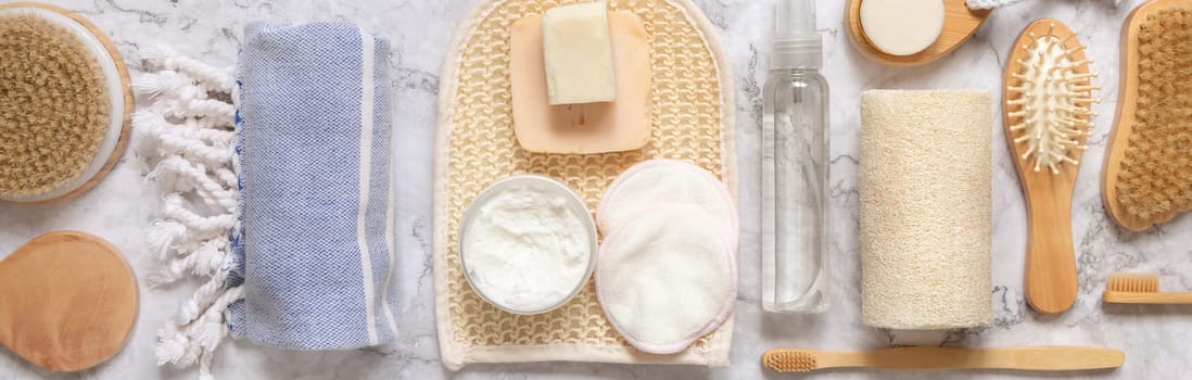 Organic natural cosmetics and zero waste reusable accessories for skin and hair care on marble flat lay. Top view of eco friendly beauty products for bath, massage or spa salon