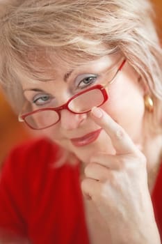 Behind red glasses