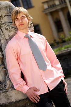A man in a pink shirt