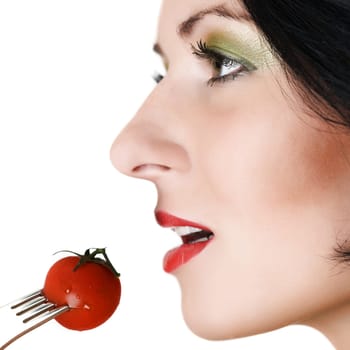 Portrait of beautiful woman with fork and tomato