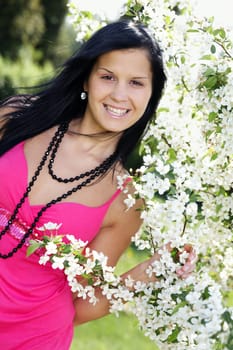 Black-haired woman poses at Apple Tree I.