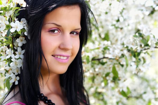 Black-haired woman poses at Apple Tree V.