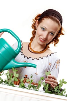 Young woman watering Erbsee I.