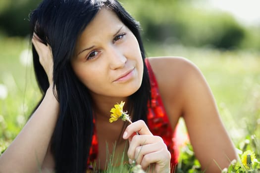Sad woman with the dandelion