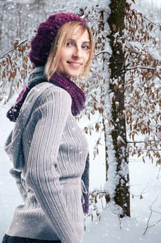 Blonde woman in snowy landscape