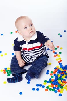 Small child with coloured discs II.