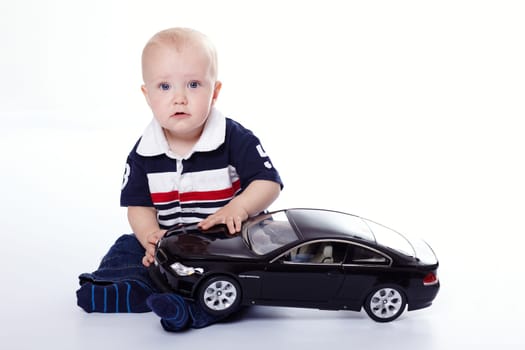 Small child by car I.