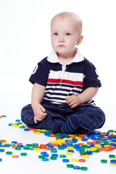 Small child with coloured discs