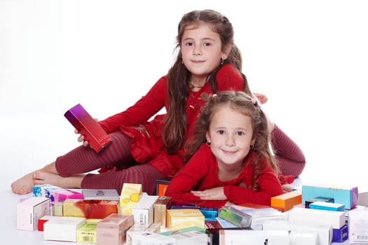 Two girls with packets of perfumes