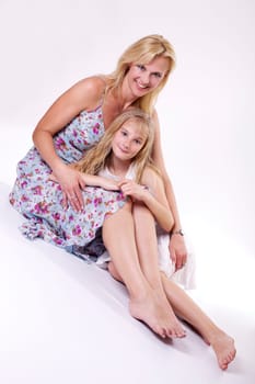 Mother and daughter dressed in summer wear