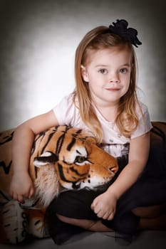 Little girl with plush tiger I