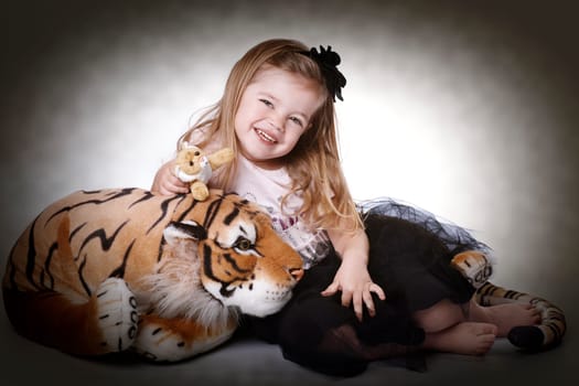 Little girl with plush tiger II