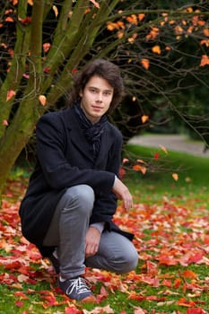 Portrait of a young man in a park