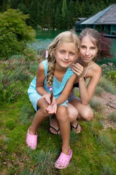 Two friends relaxing on the meadow