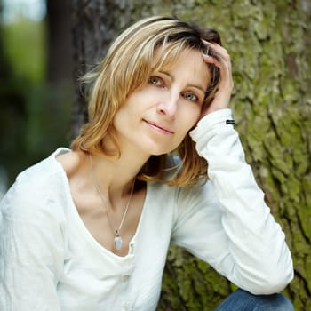 Portrait of smiling woman in a park