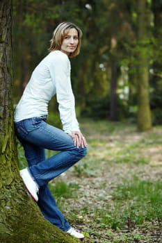 Portrait of smiling woman in a park