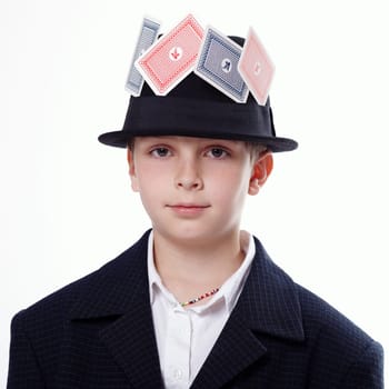 Portrait of a young boy with playing cards