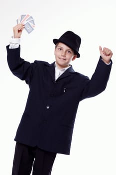 Portrait of a young boy holding playing cards