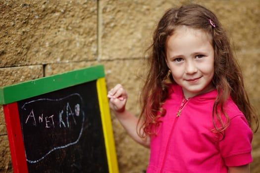 A girl writting on a board