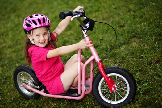 Portrait of a girl with a scooter