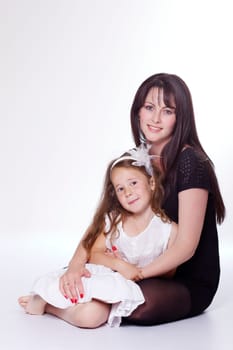 Mother hugging her daughter