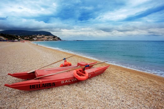 A beach with a watercraft