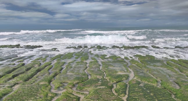 The Laomei Green Stone Trough is located in Shimen District on the North Coast, Every April and May, because the northeast monsoon slowly weakens, the local rock trough scientific name: tidal trench and sea erosion trench is covered with a large green seaweed